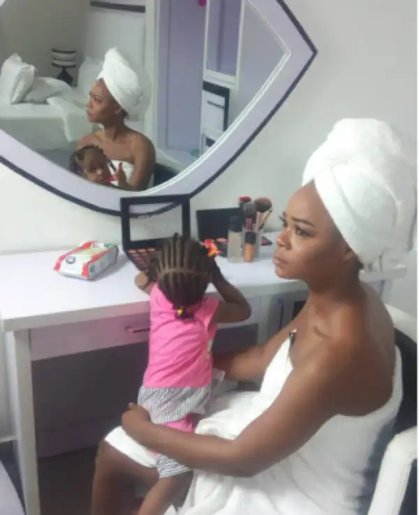 Model Olajumoke Pictured In Towel As She Poses With Her Daughter